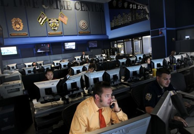 Employees work inside the Real Time Crime Center, Thursday, July 22, 2010, at police headquarters in New York. 